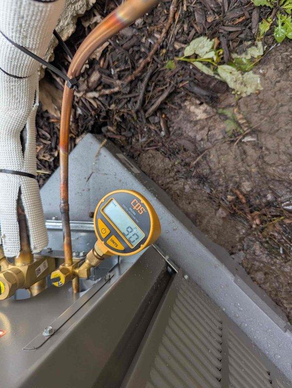 Successfully completed installation of 3-ton air conditioning system with matching evaporator coil. Installed outdoor condensing unit at rear of property on prepared pad with proper clearances from building foundation. Ran and connected copper refrigerant lines from outdoor unit to indoor coil using proper brazing techniques and flare fittings. Mounted evaporator coil above existing Lennox furnace in basement utility area, integrating with existing ductwork via metal plenum. Made all necessary electrical connections to outdoor unit and indoor components per manufacturer specifications and local electrical codes. Completed mechanical connections including refrigerant line sets with appropriate insulation. Evacuated system to remove moisture and non-condensables, then charged system with proper refrigerant type and quantity per manufacturer specifications. System startup performed with digital pressure gauges confirming operating pressures of 37.1 PSI on suction side, indicating proper r