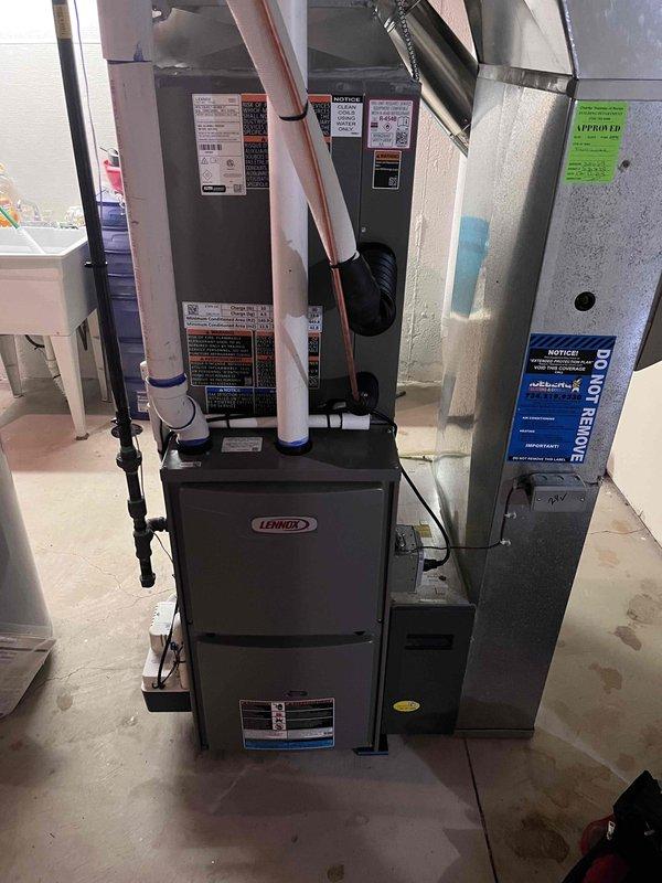 Successfully completed installation of 3-ton air conditioning system with matching evaporator coil. Installed outdoor condensing unit at rear of property on prepared pad with proper clearances from building foundation. Ran and connected copper refrigerant lines from outdoor unit to indoor coil using proper brazing techniques and flare fittings. Mounted evaporator coil above existing Lennox furnace in basement utility area, integrating with existing ductwork via metal plenum. Made all necessary electrical connections to outdoor unit and indoor components per manufacturer specifications and local electrical codes. Completed mechanical connections including refrigerant line sets with appropriate insulation. Evacuated system to remove moisture and non-condensables, then charged system with proper refrigerant type and quantity per manufacturer specifications. System startup performed with digital pressure gauges confirming operating pressures of 37.1 PSI on suction side, indicating proper r