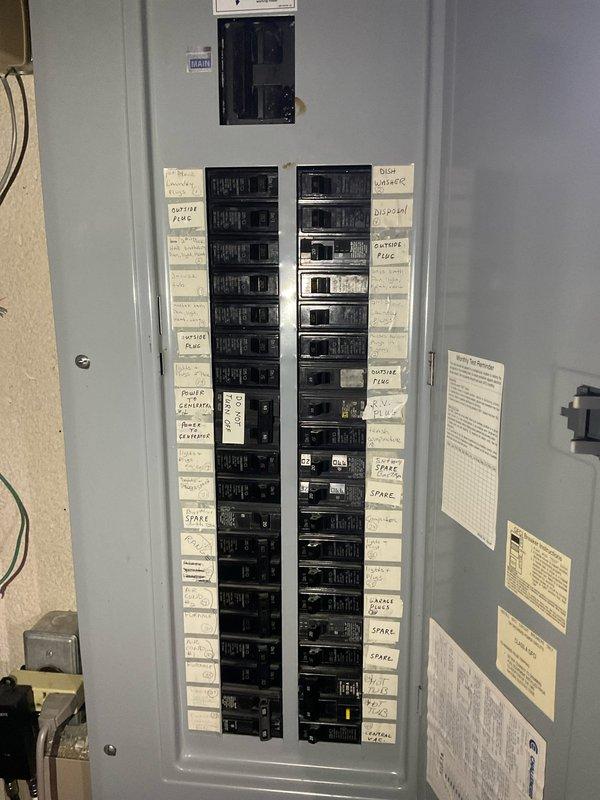 Conducted on-site HVAC estimate for air conditioning system replacement. Evaluated existing electrical infrastructure and documented current electrical panel configuration to assess compatibility with new AC equipment installation. Photographed electrical service panel showing circuit breaker layout, labeling system, and available capacity for future air conditioning unit connection.