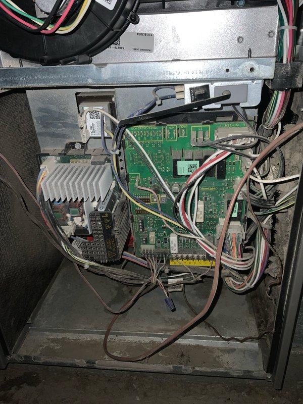 Responded to no cooling complaint with reported humming noise. Upon inspection, found blower motor experiencing mechanical failure causing abnormal operational sounds. Examined blower assembly and control board for related issues. Documented equipment condition including dust accumulation on blower wheel and verified all electrical connections at control board were secure. Recommended blower motor replacement to restore proper system operation and eliminate humming noise.