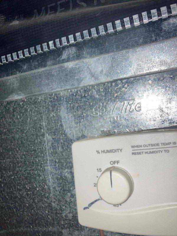 Completed routine preventive maintenance inspection under Club AC12-4 agreement. Performed comprehensive system evaluation including inspection of humidity control device, electrical components, and control panel wiring. Observed moderate corrosion and oxidation on metal surfaces near humidity control, indicating potential moisture exposure. Documented equipment condition with photographs showing humidity controller set points, electrical connections, and control wiring configuration. All electrical connections secure and operational. System functional at time of inspection.