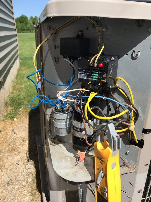 Responded to emergency no-cooling call on twelve-year-old central air conditioning system. Upon arrival, performed diagnostic testing with multimeter to identify failed capacitor as root cause of system failure. Removed defective dual-run capacitor, installed replacement unit with proper MFD rating, and verified all electrical connections to contactor and compressor. System tested successfully with normal amperage draw and proper cooling operation restored.