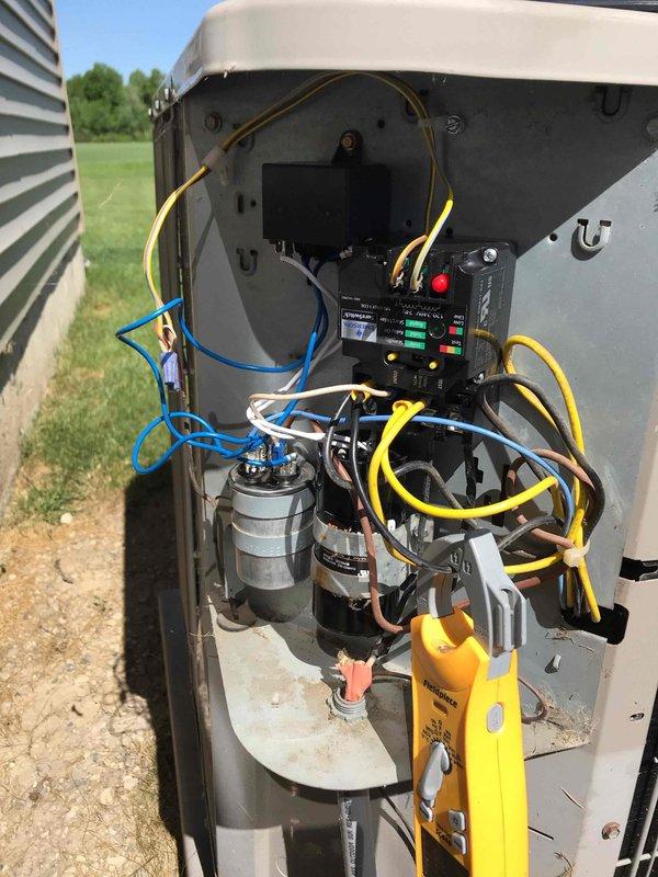 Responded to emergency no-cooling call on twelve-year-old central air conditioning system. Upon arrival, performed diagnostic testing with multimeter to identify failed capacitor as root cause of system failure. Removed defective dual-run capacitor, installed replacement unit with proper MFD rating, and verified all electrical connections to contactor and compressor. System tested successfully with normal amperage draw and proper cooling operation restored.