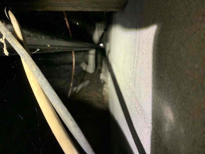 Completed warranty pressure test on electrical generator installation in crawl space. Inspected all conduit runs, mounting brackets, and wiring connections secured to floor joists per code requirements. Verified system integrity with no leaks detected, documented installation with photos showing proper support strapping and structural mounting in confined space area.