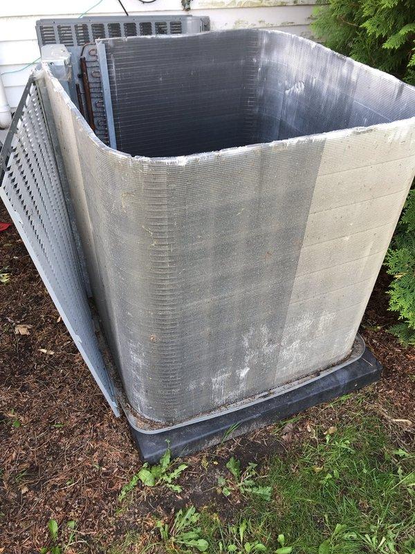 Completed preventative maintenance agreement visit for club AC10-2 air conditioning system. Performed comprehensive inspection of outdoor condenser unit, removing protective casing to access and evaluate internal heat exchanger coils and components. Inspected underfloor access point and structural areas to assess system accessibility and overall installation condition. All components photographed and documented for maintenance records. Unit operational upon completion of inspection.