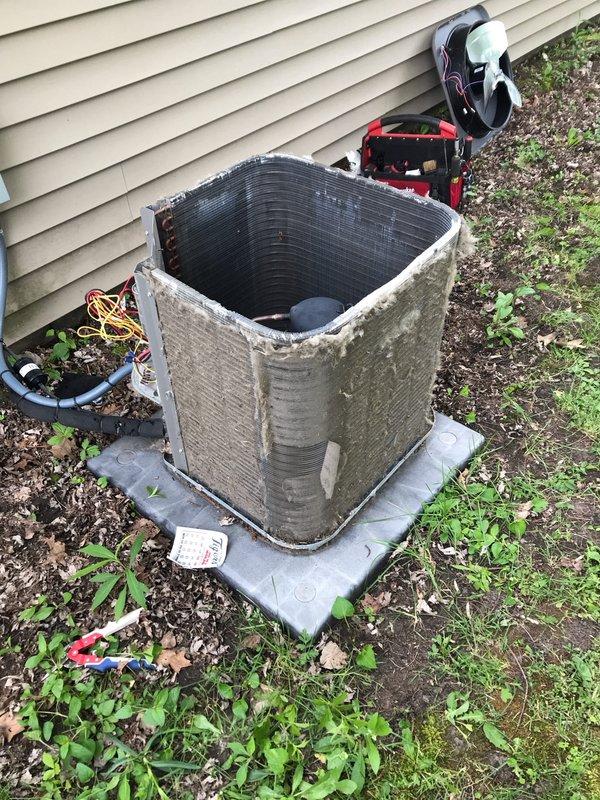 Completed prepaid AC maintenance tune-up as part of annual membership agreement. Performed comprehensive system inspection of outdoor condenser unit and indoor furnace components, verified proper operation of all equipment, cleaned accessible surfaces, and documented system condition with photos. Unit exterior showed normal weathering and soil accumulation; all mechanical components functioning within normal parameters at time of service.