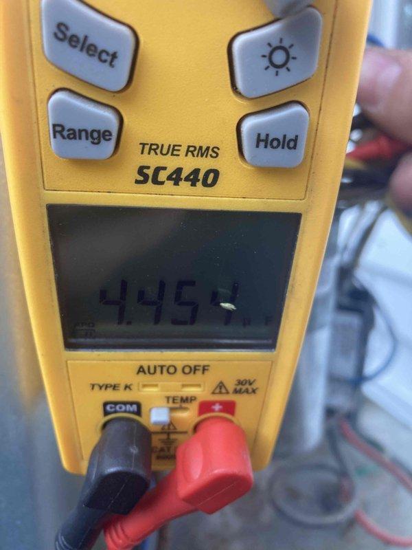 Performed preventive maintenance tune-up on air conditioning system. Verified system operation with multimeter readings showing 445 volts, inspected blower wheel assembly and housing components for proper function and cleanliness. All components operating within normal parameters at time of departure.
