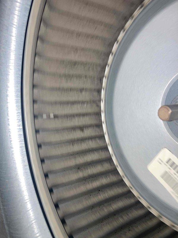 Performed preventive maintenance tune-up on air conditioning system. Verified system operation with multimeter readings showing 445 volts, inspected blower wheel assembly and housing components for proper function and cleanliness. All components operating within normal parameters at time of departure.