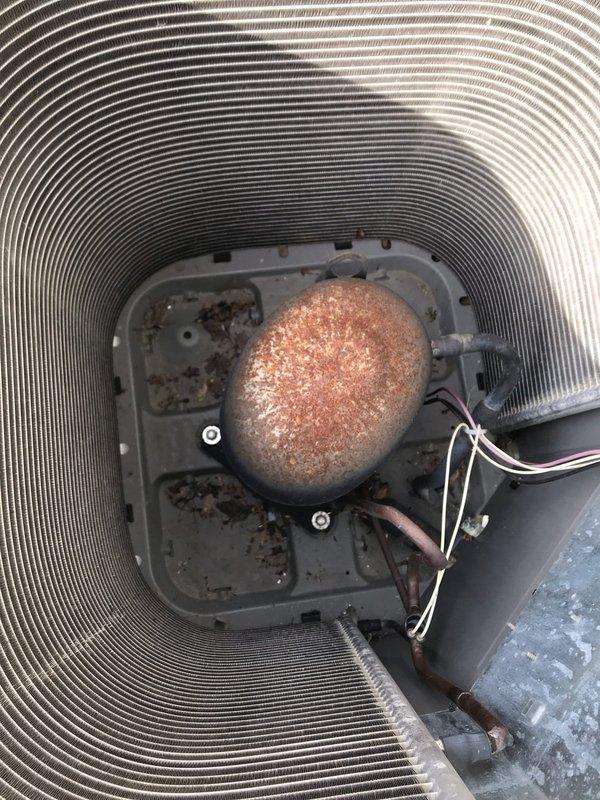 Completed routine maintenance inspection on residential air conditioning system under club membership agreement. Performed visual inspection of outdoor condenser unit, documenting equipment condition including heat exchanger coils, compressor housing, and refrigerant line connections. Unit operational with normal wear patterns observed on exterior components and minor debris accumulation noted on internal mounting surfaces.