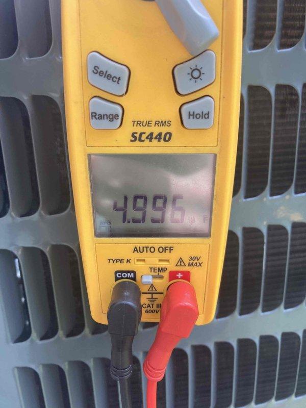 Completed preventive tune-up maintenance on residential air conditioning system. Performed temperature differential testing across evaporator coil using digital multimeter, recording satisfactory readings of 4.896 degrees. Inspected and replaced standard pleated air filter with cardboard frame to ensure proper airflow and system efficiency. All components operating within normal parameters upon completion of service.