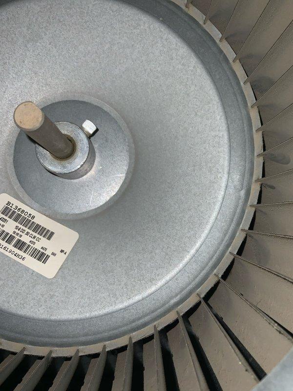 Completed preventive maintenance tune-up on air conditioning system over 10 tons. Inspected blower assembly and evaporator coil, noting dust accumulation on coil fins and minor rust discoloration on refrigerant line connections. Documented equipment condition with photographs for service records.