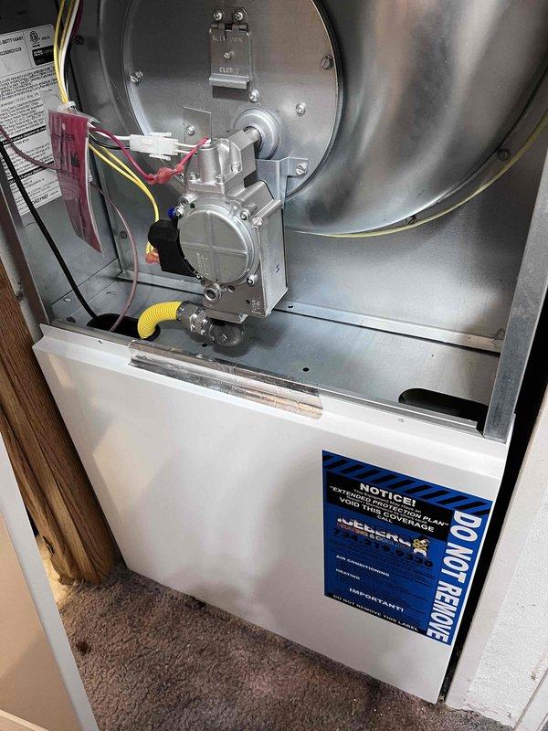 Completed full HVAC system installation including a 70,000 BTU furnace with mobile home evaporator coil and 2.5-ton air conditioning unit in rear yard location. Installed new thermostat, verified all electrical connections, and reconnected system components per manufacturer specifications with proper ductwork integration and secure mounting.