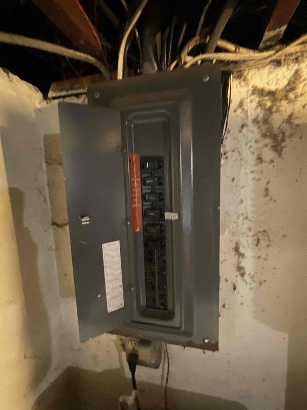 Completed site assessment for HVAC system replacement quote. Unit not providing adequate cooling. Inspected electrical panel and circuit breakers in basement utility area to verify electrical capacity and compatibility for new equipment installation. Evaluated attic space access and existing infrastructure including electrical conduit routing and structural considerations for equipment placement. Documented current electrical service configuration and mechanical space conditions to prepare comprehensive replacement estimate.