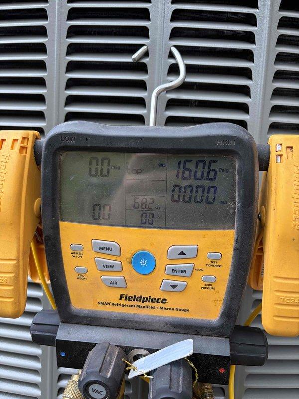 Successfully completed installation of 2-ton air conditioning system with matching evaporator coil in rear configuration. Performed all mechanical and electrical connections to integrate new AC unit with existing furnace system. Verified proper refrigerant charge using digital manifold gauges, confirming system pressures within manufacturer specifications. Tested all electrical connections and controls to ensure safe operation. System commissioned and left in full working order with proper airflow through ductwork.