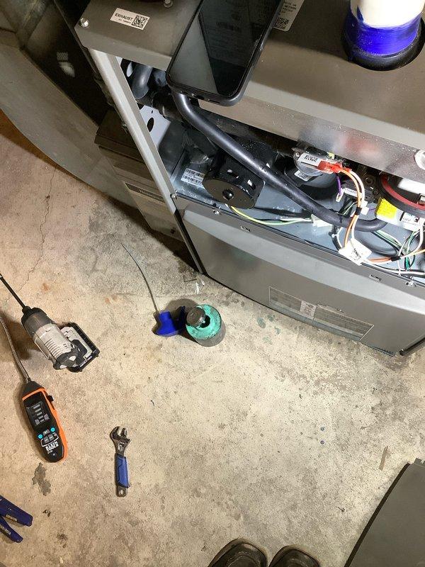 Responded to emergency call for reported gas leak from HVAC system. Upon arrival, confirmed system had been shut off for safety. Performed comprehensive inspection of unit interior, accessing control compartment and examining all gas connections, electrical components, and wiring harnesses. Utilized digital multimeter to verify electrical integrity and conducted thorough leak detection protocol. Inspected furnace housing, burner assembly access areas, and all visible gas line connections for signs of compromise. Documented equipment condition with detailed photographs showing internal components, manufacturer labels, and overall system configuration for service records. System remained in safe, powered-down state pending further diagnostic evaluation and repair authorization.