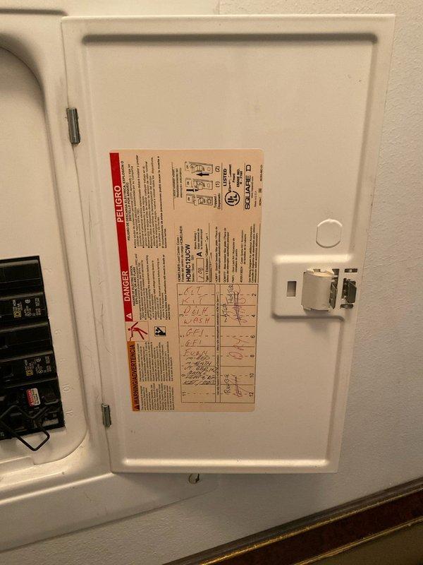 Conducted comprehensive assessment of existing residential water heater installation showing visible signs of deterioration and corrosion staining on exterior tank surface. Documented current water heater condition including rust streaking from top connections, existing copper supply piping configuration, pressure relief valve assembly, and flexible connector installations. Evaluated utility closet space constraints and clearance requirements for potential replacement unit. Photographed electrical panel configuration and circuit availability to support water heater replacement specifications. Provided detailed estimate for 8-10 year warranty water heater replacement including removal of existing unit, installation of new water heater with proper venting, code-compliant connections, and necessary permit coordination.