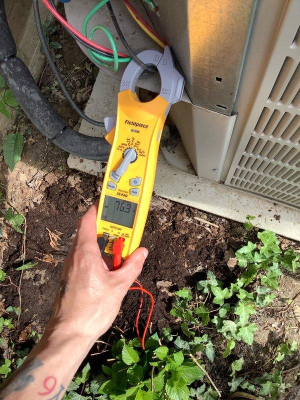 Completed comprehensive AC tune-up on 14-year-old system with no reported issues. Performed standard maintenance protocol including amperage draw testing (7.05A recorded), refrigerant pressure analysis across all ports, and system diagnostics using digital manifold gauges. All electrical connections inspected, condenser unit cleaned, and operational parameters verified within manufacturer specifications for continued reliable performance.