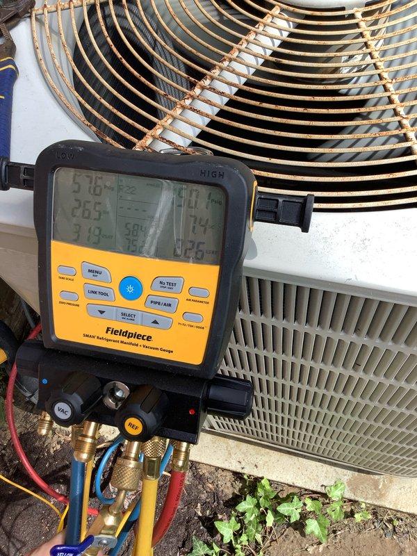 Completed comprehensive AC tune-up on 14-year-old system with no reported issues. Performed standard maintenance protocol including amperage draw testing (7.05A recorded), refrigerant pressure analysis across all ports, and system diagnostics using digital manifold gauges. All electrical connections inspected, condenser unit cleaned, and operational parameters verified within manufacturer specifications for continued reliable performance.