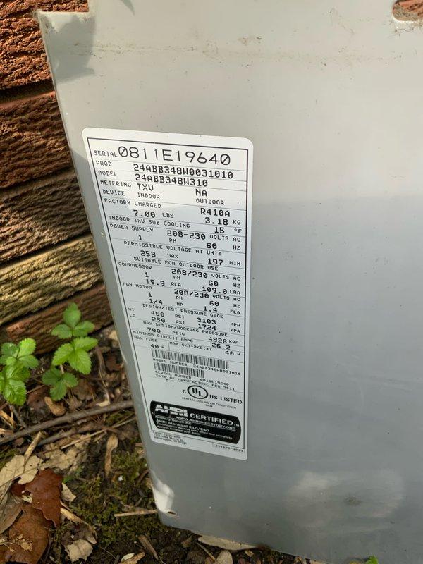 Responded to no-cool call on 20-year-old central air conditioning system that struggled to start this spring and was running but not producing cooling. Upon arrival, performed diagnostic inspection of outdoor condensing unit, examining electrical components including capacitor, wiring harness, and contactor assembly. Unit identified as a 2½-ton R410A system (Model 244BB345H0310) with TXV metering device, factory charged with 7.00 lbs refrigerant, rated at 208-230V with 17A minimum circuit ampacity. Documented system condition through photographs showing weathered electrical panel with exposed capacitor and wire connections, as well as unit nameplate data. Given the advanced age of the equipment at 20 years old—well beyond typical 10-15 year service life expectancy—and reported performance issues, provided comprehensive system evaluation and discussed repair versus replacement options with customer to help determine most cost-effective solution for restoring cooling comfort to the home.