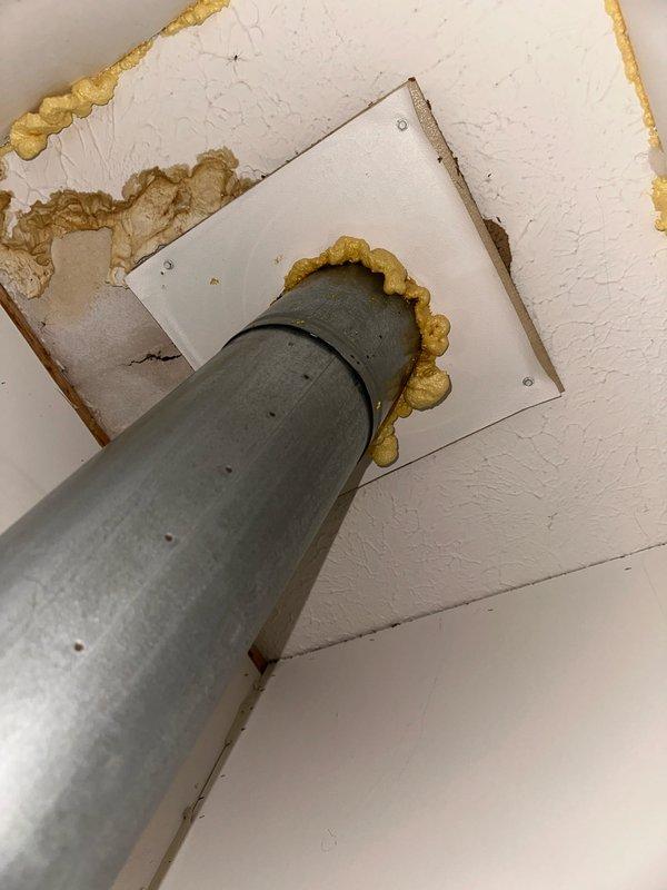 Completed installation of A.O. Smith ProLine commercial-grade tanked water heater in residential utility closet. Installed new unit with proper plumbing connections including hot and cold water lines, pressure relief valve with discharge piping, and flexible connector hoses at top of tank. Secured all copper and brass fittings at base and top of unit per manufacturer specifications. Ensured proper venting through ceiling penetration with PVC pipe, sealed with expanding foam insulation and metal escutcheon plate. Verified all safety labels, warranty information, and manufacturer specifications are visible and intact on unit. Reconnected all water supply lines and tested system for proper operation and leak-free connections. Installation completed with all code-compliant materials and methods.