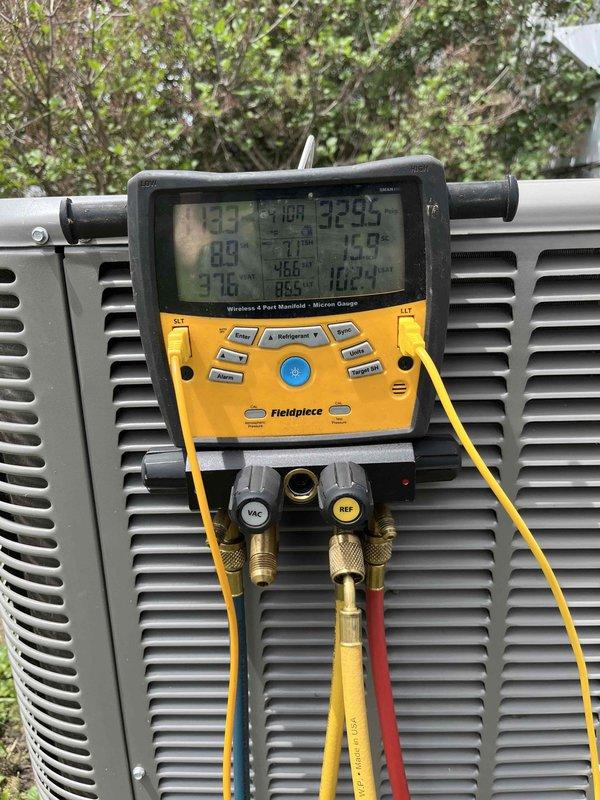 # HVAC Service Report - No Cool Condition

Responded to no cooling complaint on system less than 10 years old. Removed evaporator coil for thorough cleaning to restore proper heat transfer and system efficiency. Connected digital manifold gauges to outdoor condensing unit to monitor system pressures and temperatures during diagnostic process. Documented equipment readings and condition with photos for service records. Cleaning of evaporator coil completed to address airflow restriction and reduced cooling capacity.