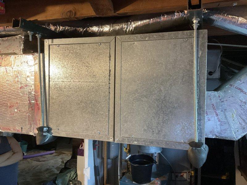 Completed comprehensive assessment of existing HVAC system for full replacement estimate. Inspected attic-mounted air handler unit showing typical wear and dust accumulation, evaluated ductwork insulation and vapor barrier condition, and assessed structural mounting and drainage components. Examined exterior condensing unit location, electrical service connections, conduit routing, and site conditions including ground clearance requirements and accessibility for equipment replacement.