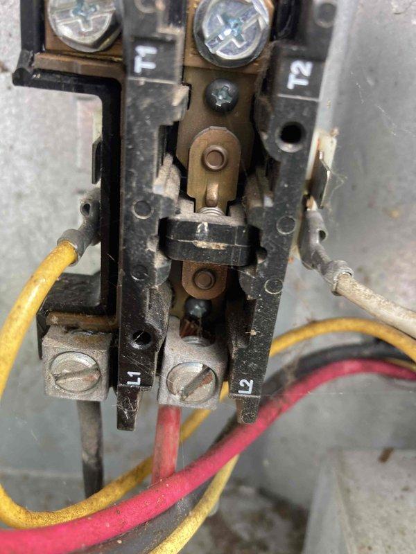 Completed routine air conditioning maintenance visit under club agreement. Performed electrical diagnostics using multimeter, recording voltage reading of 382.5V at the contactor assembly. Inspected contactor terminals, connections, and mechanical components, noting normal wear consistent with system age and operation. All electrical connections secure and system operating within specifications.
