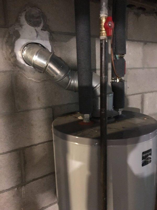 Responded to service call for non-operational water heater. Upon arrival, diagnosed Kenmore tanked water heater failure. Removed existing failed unit and installed new replacement water heater with proper venting and plumbing connections. Connected gas supply line, installed temperature and pressure relief valve with discharge piping, and verified all copper and black pipe connections were secure and code-compliant. Tested unit operation, confirmed proper ignition sequence, and verified hot water delivery throughout system. Left installation clean and fully operational.