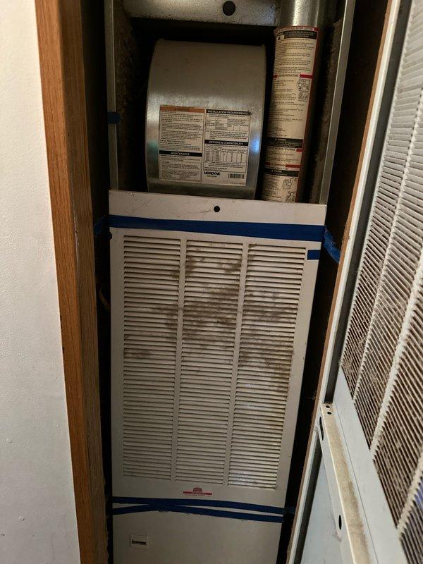 Completed installation of new tanked water heater in residential utility closet. Removed existing unit and installed replacement water heater with proper hot and cold water line connections using color-coded piping (red for hot, blue for cold supply). Ensured all connections were secure with appropriate valves and fittings, verified proper placement on concrete pad, and confirmed all safety labels and warnings were visible and intact per manufacturer specifications. Unit tested and operational upon completion.