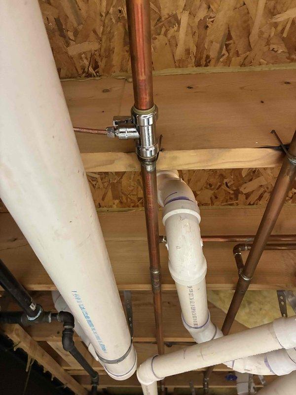 Completed full HVAC system installation including a 70,000 BTU furnace and 3-ton air conditioning unit positioned in left side yard. Installed new furnace in basement utility room with proper venting and ductwork connections, completed all mechanical and electrical connections per code requirements. Routed copper refrigerant lines and PVC condensate drainage through ceiling joists, installed pressure relief valve and necessary plumbing components. Reconnected all system components, tested operation, and verified proper airflow and temperature control throughout residence.