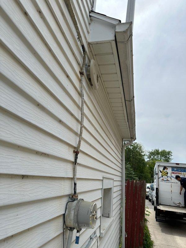 Completed warranty service call for installation of flush mount kit on exterior HVAC equipment. Successfully installed flush mount components to customer specifications, ensuring proper mounting to vinyl siding and maintaining appropriate clearances from utility meter and electrical conduit. All installation work performed in accordance with manufacturer guidelines and verified secure attachment to building exterior.