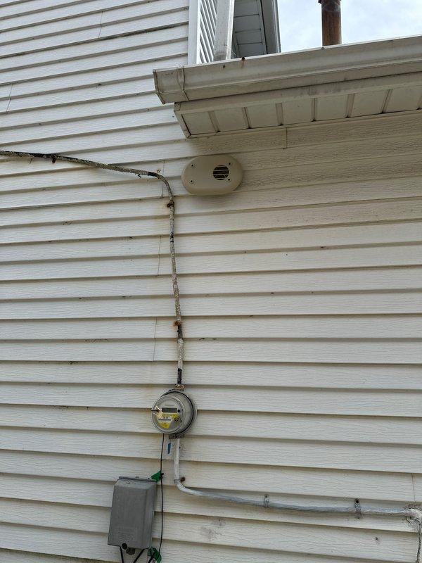 Completed warranty service call for installation of flush mount kit on exterior HVAC equipment. Successfully installed flush mount components to customer specifications, ensuring proper mounting to vinyl siding and maintaining appropriate clearances from utility meter and electrical conduit. All installation work performed in accordance with manufacturer guidelines and verified secure attachment to building exterior.