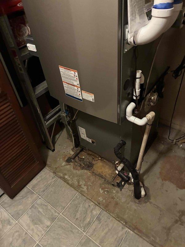 Completed installation of a 90,000 BTU Lennox furnace system in residential basement utility area. Connected all necessary PVC venting, condensate drainage lines, gas supply, and electrical connections per manufacturer specifications and local building codes. System tested and verified operational with all safety controls functioning properly.