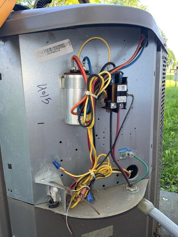 Responded to no cooling complaint on residential air conditioning unit. Upon inspection, found failed dual run capacitor preventing compressor and condenser fan motor operation. Removed defective capacitor, installed new replacement capacitor with proper microfarad ratings, verified all electrical connections secure, and tested system operation. Unit cooling properly at time of departure.