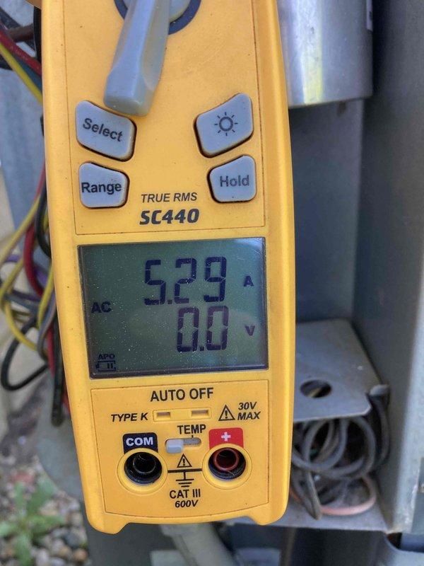 Completed routine preventive maintenance inspection on air conditioning system as part of CLUB AC 8-12 agreement. Performed electrical diagnostics using digital multimeter, recording amperage draw of 5.29A and verifying voltage readings on system components. Inspected and tested capacitor and electrical connections, confirming all measurements within manufacturer specifications for proper system operation.