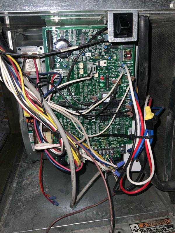 Completed preventive maintenance tune-up on HVAC system. Inspected control board and electrical connections, verified proper wiring terminations and component operation. Observed dust accumulation on blower assembly and housing; noted normal operational wear consistent with system usage requiring standard cleaning during maintenance service.