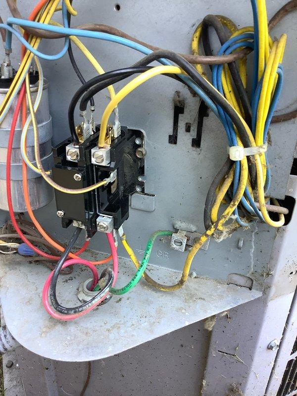 # AC NOT TURNING ON 2-689

Responded to service call for air conditioning system not turning on. Upon arrival, performed diagnostic assessment of outdoor condensing unit and electrical components. Inspection revealed issues within the electrical control panel, with evidence of aging wiring and deteriorated connections affecting system operation.

Utilized Fieldpiece SMAN refrigerant manifold and vacuum gauge to assess system pressures and temperatures. Digital readings indicated elevated discharge temperature of 159.5°F along with multiple pressure measurements across the refrigerant circuit. Connected manifold gauges to service ports to verify system operating parameters and identify potential refrigerant circuit concerns.

Examined electrical control panel and contactor assembly. Found aged wiring with significant dirt accumulation and insulation deterioration throughout the panel. Multiple wire connections showed signs of environmental exposure, corrosion, and general weathering con