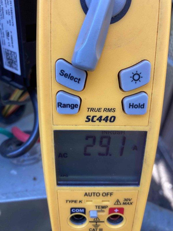 Responded to service call for club AC maintenance rescheduling request. Performed electrical diagnostics on air conditioning system, measuring amperage draw of 29.1 amps AC and recording voltage reading of 5.06 volts on system components. Documented equipment conditions and electrical parameters for maintenance records.