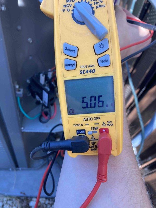Responded to service call for club AC maintenance rescheduling request. Performed electrical diagnostics on air conditioning system, measuring amperage draw of 29.1 amps AC and recording voltage reading of 5.06 volts on system components. Documented equipment conditions and electrical parameters for maintenance records.