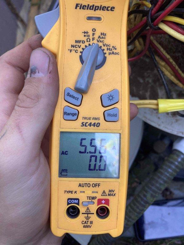 Completed routine AC and furnace tune-up maintenance on system 798-12. Performed electrical diagnostics using multimeter to verify proper voltage and amperage readings, with measurements showing 5.5 AC amps at the outdoor unit. Inspected outdoor condenser unit and found significant rust and corrosion on metal housing and panels, though unit remains operational. All electrical connections, including thermostat wiring and line voltage circuits, were inspected and found secure with proper wire nut connections intact.