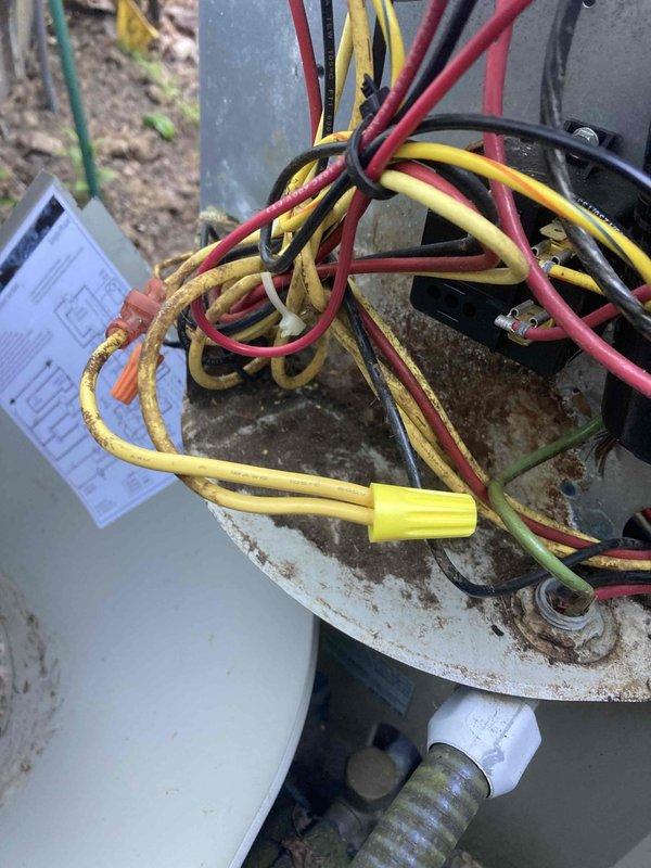 Completed routine AC and furnace tune-up maintenance on system 798-12. Performed electrical diagnostics using multimeter to verify proper voltage and amperage readings, with measurements showing 5.5 AC amps at the outdoor unit. Inspected outdoor condenser unit and found significant rust and corrosion on metal housing and panels, though unit remains operational. All electrical connections, including thermostat wiring and line voltage circuits, were inspected and found secure with proper wire nut connections intact.