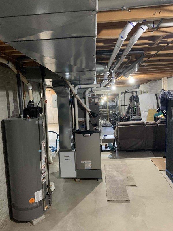 Completed warranty service on residential HVAC system, installing air scrubber unit into existing ductwork near furnace and returning thermostat to customer. Installation verified proper integration with heating system, all connections secured, and unit operational upon departure.