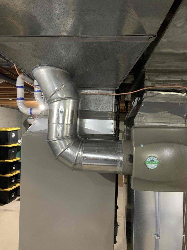 Completed warranty service on residential HVAC system, installing air scrubber unit into existing ductwork near furnace and returning thermostat to customer. Installation verified proper integration with heating system, all connections secured, and unit operational upon departure.