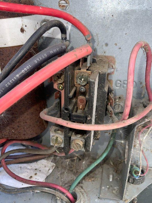 Responded to no cooling call on 10+ year old system. Upon arrival, found outdoor unit completely inoperative with visible burn marks around exterior disconnect box and on mounting surface. Inspection revealed extensive electrical damage with heavy soot and carbon deposits throughout disconnect enclosure, indicating significant arcing event. Internal components showed severe deterioration with tarnished terminals and blackened surfaces. Outdoor unit contactor also exhibited signs of electrical failure with discolored wiring connections and aged components. Documented damage with photos for customer review. System deemed unsafe to operate due to extent of electrical damage. Provided repair options including disconnect box replacement, contactor replacement, and full electrical system evaluation to determine source of failure and prevent recurrence.