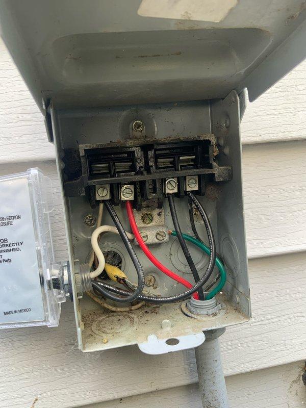 Responded to cooling deficiency complaint on residential AC system. Upon inspection, accessed outdoor condensing unit and electrical disconnect to evaluate system components. Examined capacitor, contactor assembly, and electrical connections. Documented condition of electrical wiring, terminal blocks, and internal components showing signs of weathering and debris accumulation. Verified proper electrical connections and component mounting. System evaluated as part of club maintenance agreement visit.