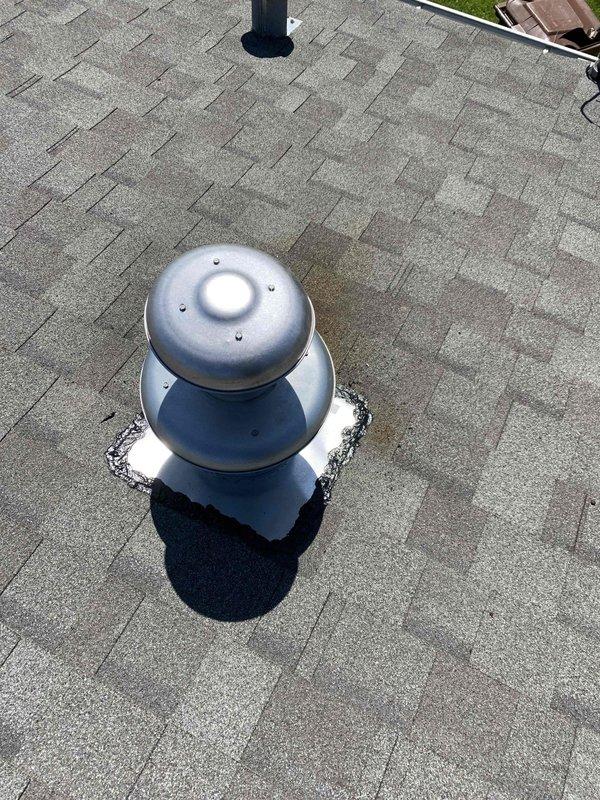 Completed warranty service to replace defective roof jack assembly on residential HVAC system. Removed existing roof penetration vent and installed new dual-dome metallic roof jack with proper flashing and weatherproofing. Secured new galvanized metal vent cap assembly to roof deck, ensuring proper seal around pipe penetration using square rubber boot flashing material. Applied appropriate sealant to prevent water intrusion at shingle interface. Verified all fasteners properly installed and flashing adequately sealed to maintain roof integrity. New roof jack is fully operational and properly vented.