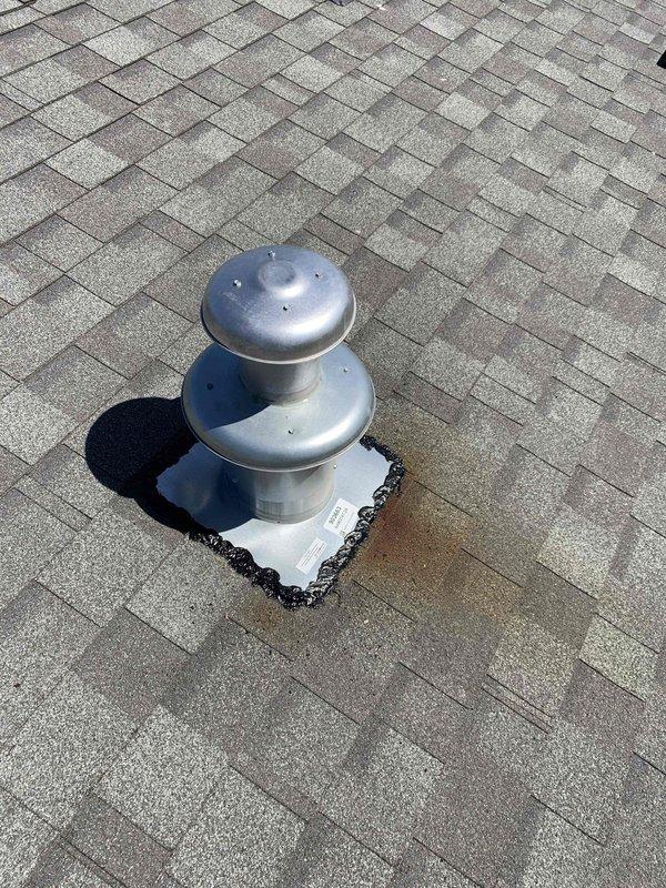 Completed warranty service to replace defective roof jack assembly on residential HVAC system. Removed existing roof penetration vent and installed new dual-dome metallic roof jack with proper flashing and weatherproofing. Secured new galvanized metal vent cap assembly to roof deck, ensuring proper seal around pipe penetration using square rubber boot flashing material. Applied appropriate sealant to prevent water intrusion at shingle interface. Verified all fasteners properly installed and flashing adequately sealed to maintain roof integrity. New roof jack is fully operational and properly vented.