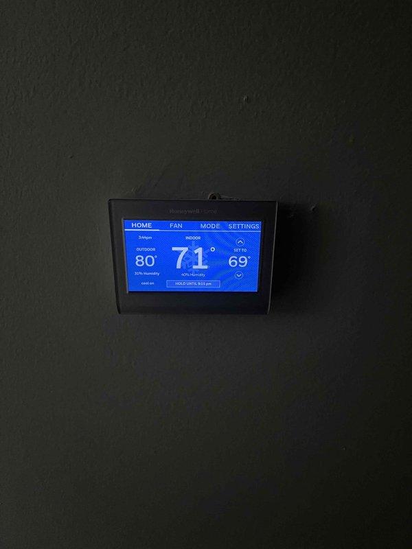 Completed installation of 3-ton air conditioning system with matching evaporator coil, including all mechanical and electrical connections. Installed new digital programmable thermostat with humidity display and multi-zone control capabilities, mounted and wired air handler unit with proper ductwork connections, and reconnected all refrigerant lines to rear-discharge outdoor condensing unit. System tested and operational upon completion.