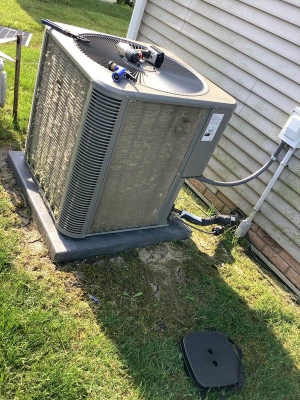 Completed scheduled maintenance agreement visit for residential AC system. Performed comprehensive inspection of indoor Miller furnace unit and outdoor condenser unit, including evaluation of fan motor assembly, electrical connections, and overall system operation. Documented equipment condition with service photos showing both indoor and outdoor components in functional status with normal wear patterns.