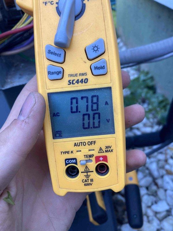 Completed scheduled AC tune-up and preventative maintenance on air conditioning system. Performed electrical diagnostics using clamp meter, measuring amperage draw at 0.78A and voltage readings to verify proper system operation. Inspected blower wheel assembly, noting moderate dust accumulation on squirrel cage fan blades and housing; cleaned and serviced blower components to ensure optimal airflow efficiency.